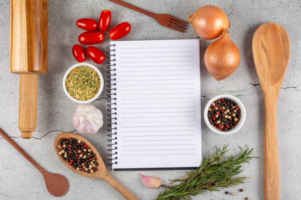 istock Cookbook with ingredients on the table.Recipe book. 1392224808