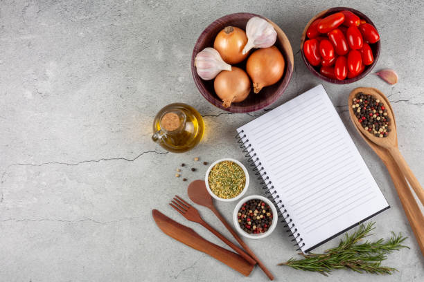istock Cookbook with ingredients on the table.Recipe book. 1392224814