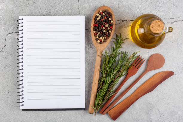 istock Cookbook with ingredients on the table.Recipe book. 1392224837