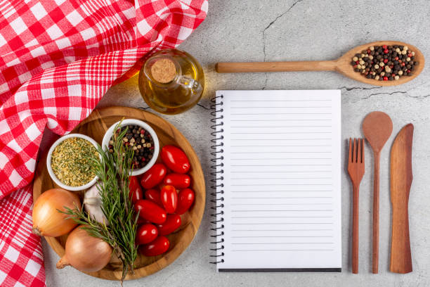istock Cookbook with ingredients on the table.Recipe book. 1392224842