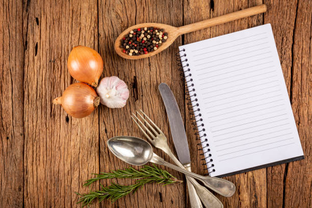 istock Cookbook with ingredients on the table.Recipe book. 1392224850