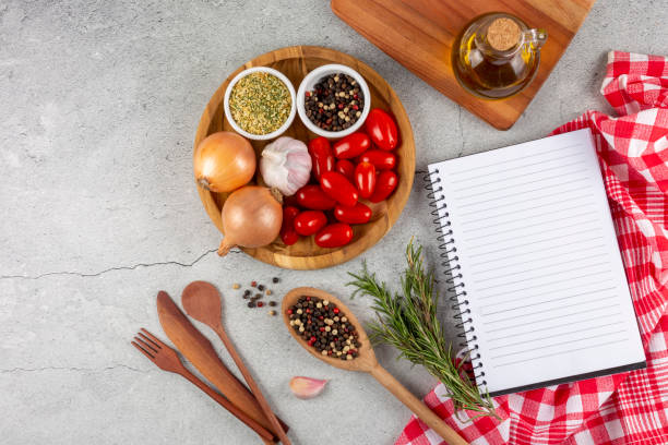 istock Cookbook with ingredients on the table.Recipe book. 1392224851