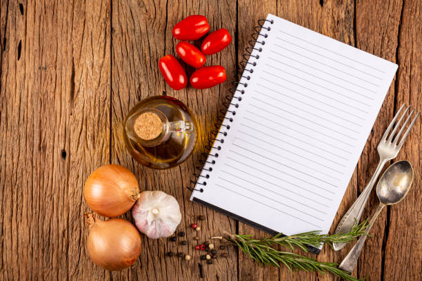 istock Cookbook with ingredients on the table.Recipe book. 1392224854