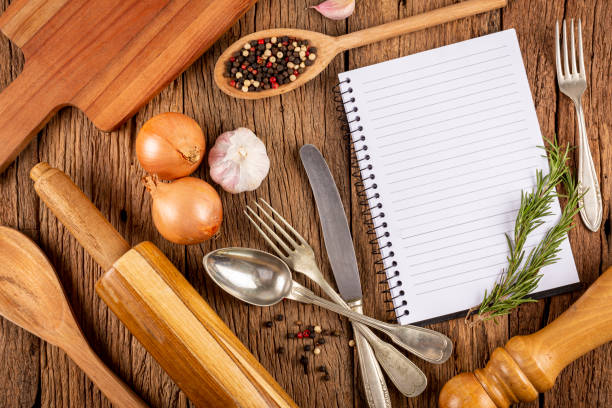 istock Cookbook with ingredients on the table.Recipe book. 1392224855