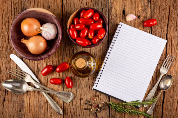 istock Cookbook with ingredients on the table.Recipe book. 1392224858