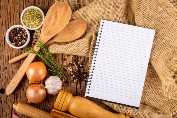 istock Cookbook with ingredients on the table.Recipe book. 1392224885