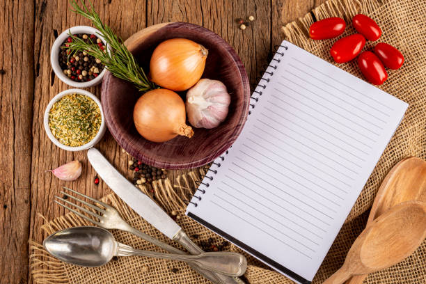 istock Cookbook with ingredients on the table.Recipe book. 1392224893