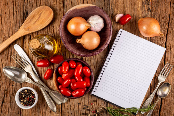 istock Cookbook with ingredients on the table.Recipe book. 1392225681