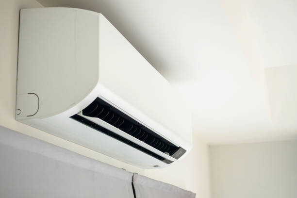 istock Air conditioner on white wall room interior background 1392227745