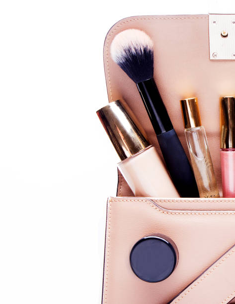 istock Makeup products with cosmetic bag on white background 1392229532