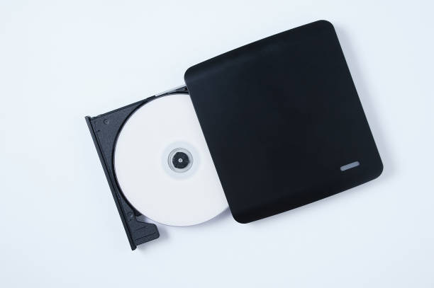 istock Black portable CD drive with CD. White background. 1392231070