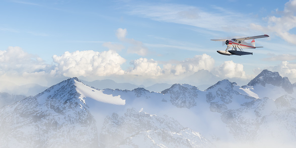 Seaplane flying over the Rocky Mountains. 3d Rendering Airplane Adventure Artwork. Aerial Image from British Columbia, Canada.