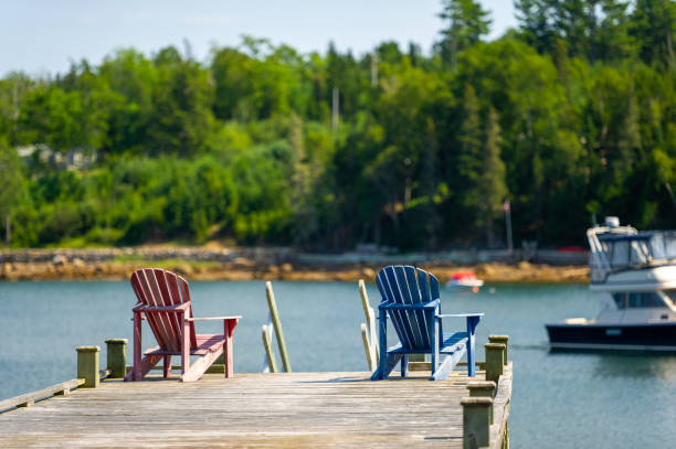 istock Two Adirondack chairs in a calm bay in Nova Scotia 1392244683