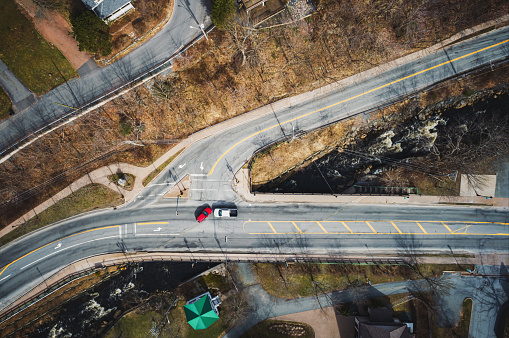 Two cars are about to collide at an intersection. Composite image.