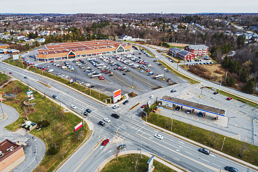 An aerial drone view of a supermarket & gas station.