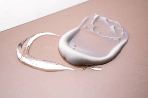 istock Serum and cream on a beige background. Textures. 1392249598