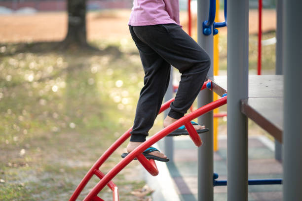 istock Kid playing on a children playground equipment. 1392250066