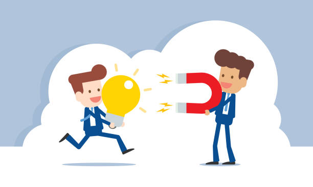 istock Businessman holding magnet in hands attracting intelligent people 1392251590