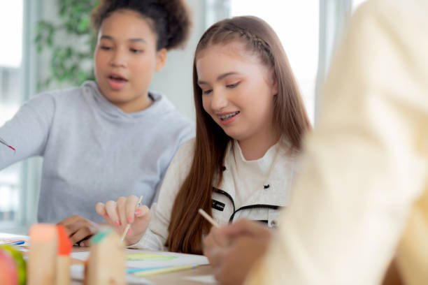 istock Group of student sitting and studying and learning drawing with teacher together in classroom at the school, pupils creativity and development for drawing in course, back to school, education concept. 1392255545