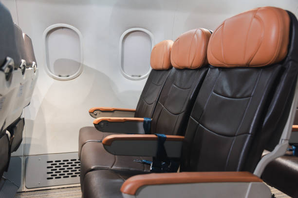 istock Empty aircraft seats and windows, passenger seat interior airplane 1392255818