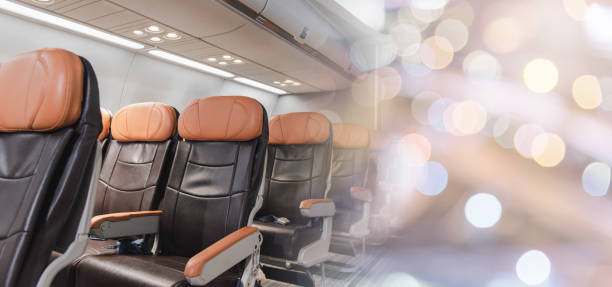 istock Empty aircraft seats and windows, passenger seat interior airplane 1392255819