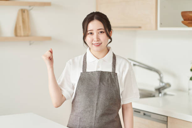 istock A woman in the housekeeping business doing a guts pose 1392255845