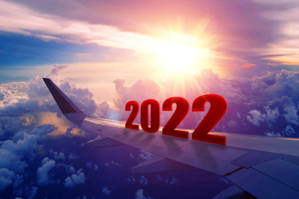 istock Airplane wing flying at sunrise in 2022 1392259107