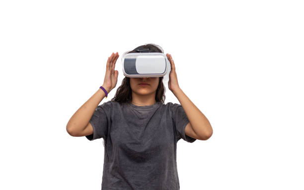istock a young girl playing with virtual reality goggles 1392261244