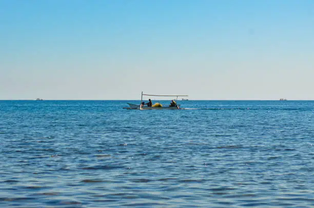 Fishermen Use Simple Boats Looking For Fish On The Sea