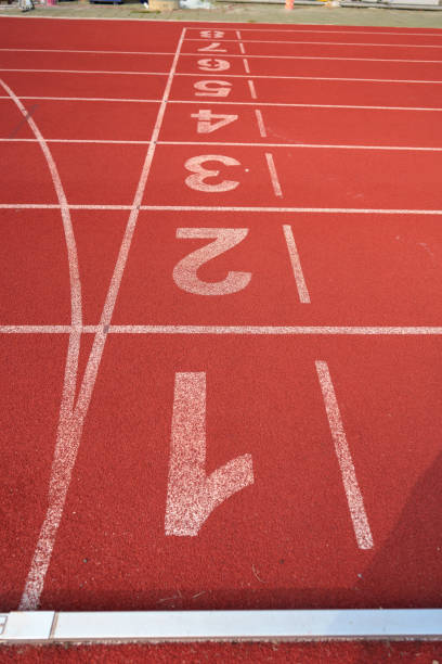 istock nobody empty Athlete Track or Running Track background for training 1392261377