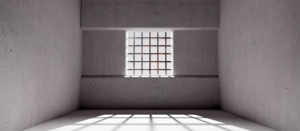 istock Empty jail with a window and prison bars, concrete walls and floor, dungeon interior. 3d render 1392262185