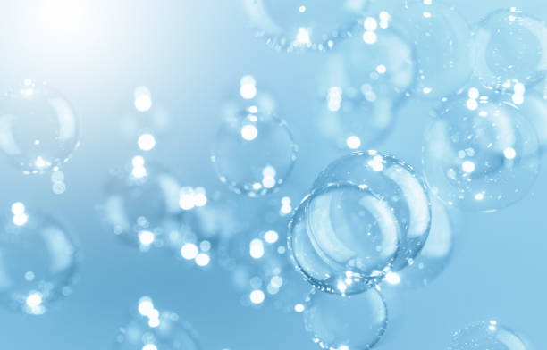 istock Beautiful Shiny Transparent Blue Soap Bubbles Background. Soap Sud Bubbles Water. 1392263277