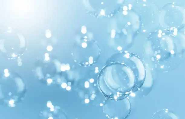 Photo of Beautiful Shiny Transparent Blue Soap Bubbles Background. Soap Sud Bubbles Water.