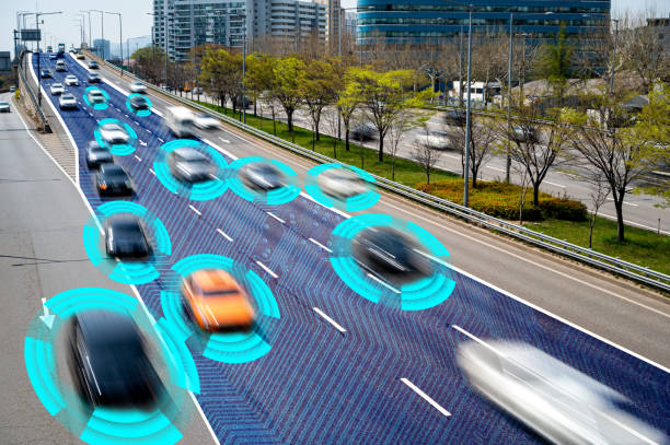 istock Autonomous Self Driving Cars Moving Through City. 1392265611