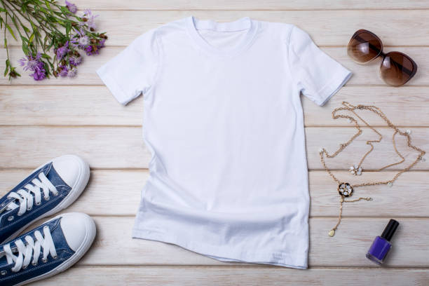 istock Womens white T-shirt mockup with burdock flowers 1392269166