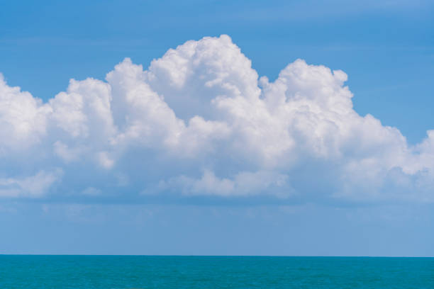 istock Blue sky, white cloud and calm sea water, sunny day 1392269361