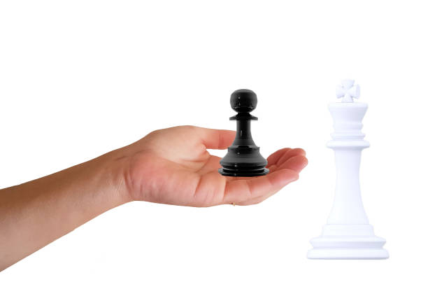 istock help to win a hand lift up a pawn to win a chess king - 3d rendering 1392269381
