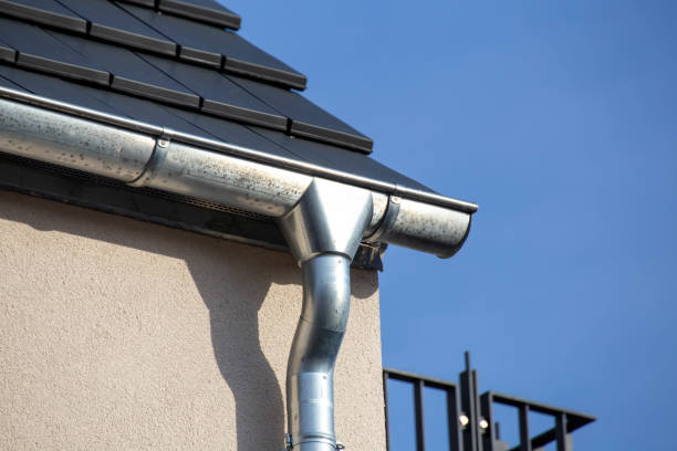 istock Roof gutter on a new tiled roof 1392270744