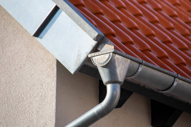 istock Roof gutter on a new tiled roof 1392270761