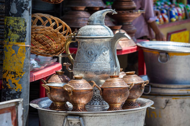 Handmade metal kettle for sell in local street market , India stock photo