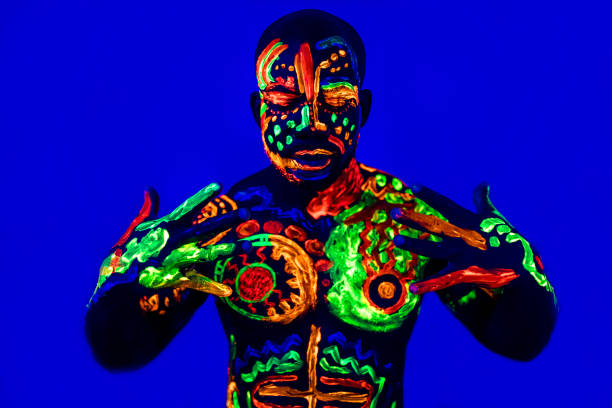 istock afro american man posing in studio shot with UV light 1392273190