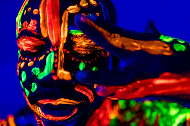 istock afro american man posing in studio shot with UV light 1392273192