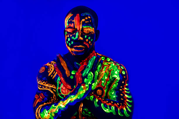 istock afro american man posing in studio shot with UV light 1392273193