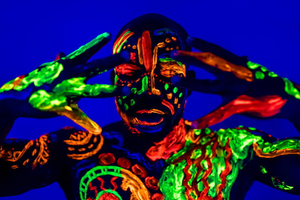 istock afro american man posing in studio shot with UV light 1392273196