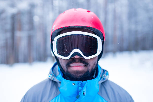istock afro american man in blue jacket run ski outdoors in freeze forest 1392273602