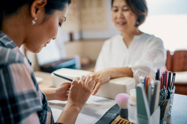 istock Millennial-aged daughter giving her mother a manicure 1392275896