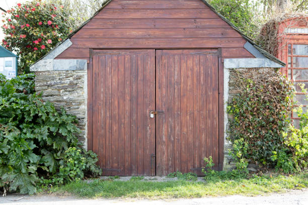 istock Wooden garage doors in a village 1392277390