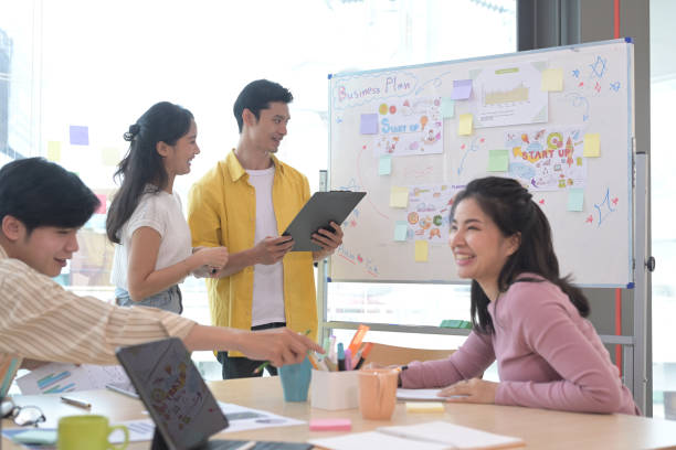 istock Group of creative people brainstorm over business project together. 1392278311
