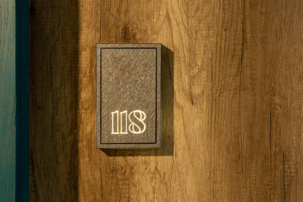 Hotel room number on wooden wall