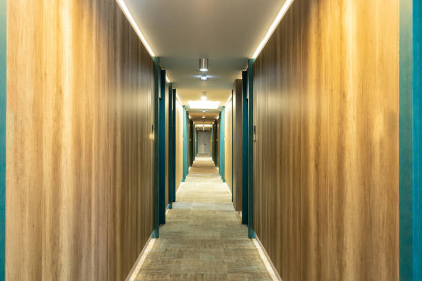 istock Carpeted corridor hallway interior with wooden walls 1392280528